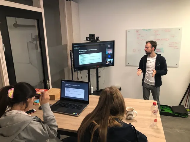 

Modern desk with tech, clothes, and research for communications and data protection