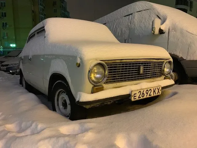 

Snowy car with registration plate "17 P E 2692 KX