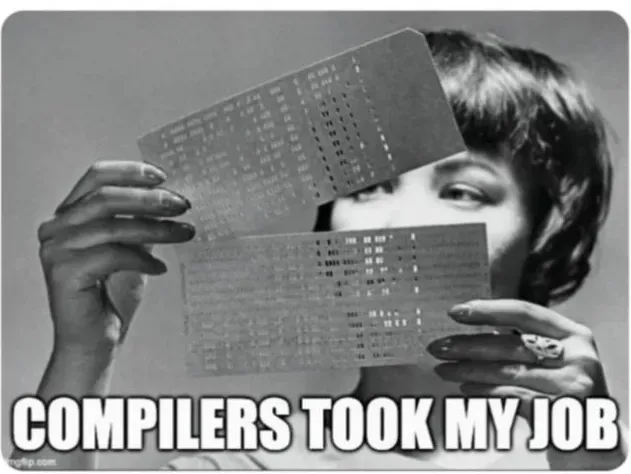 Meme: black-and-white photo of a 1960s woman holding up two punch cards, captioned COMPILERS TOOK MY JOB